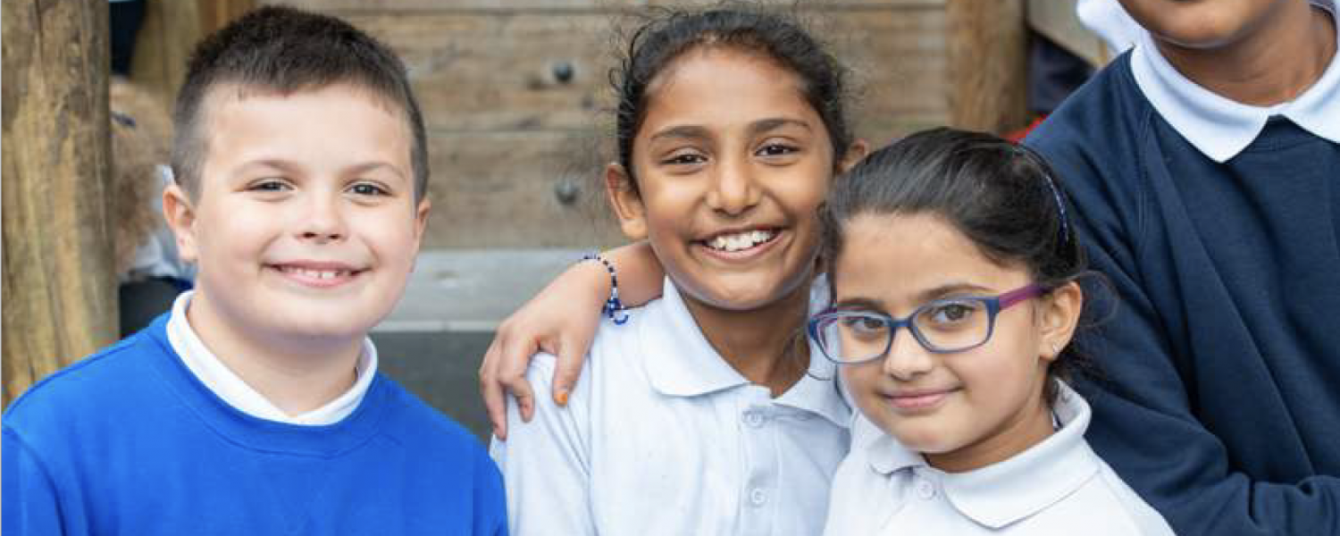 Young students smiling at camera
